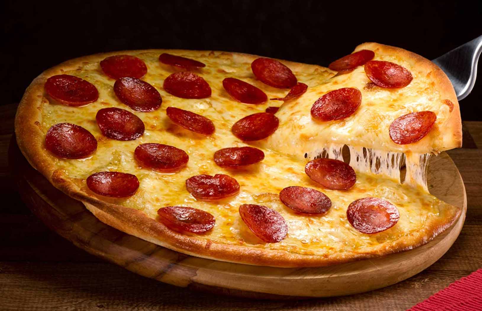 freshly baked pizza served at Erbil Fish & Chips Takeaway in Dalkeith